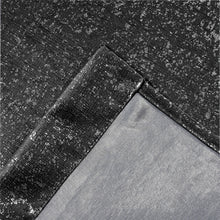 Load image into Gallery viewer, Close-up of black lurex textured curtain fabric with a diagonal seam