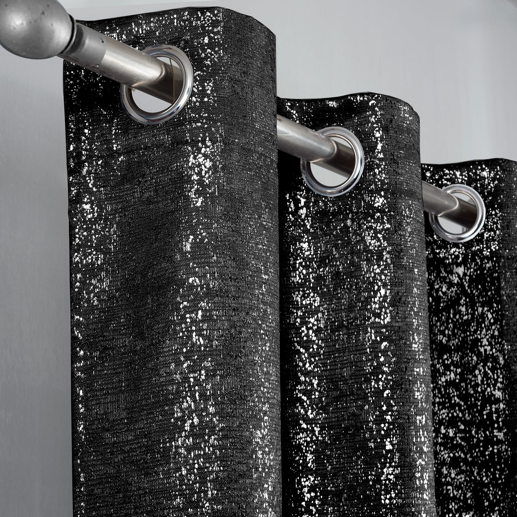 Black lurex curtains with silver rings on a gray background