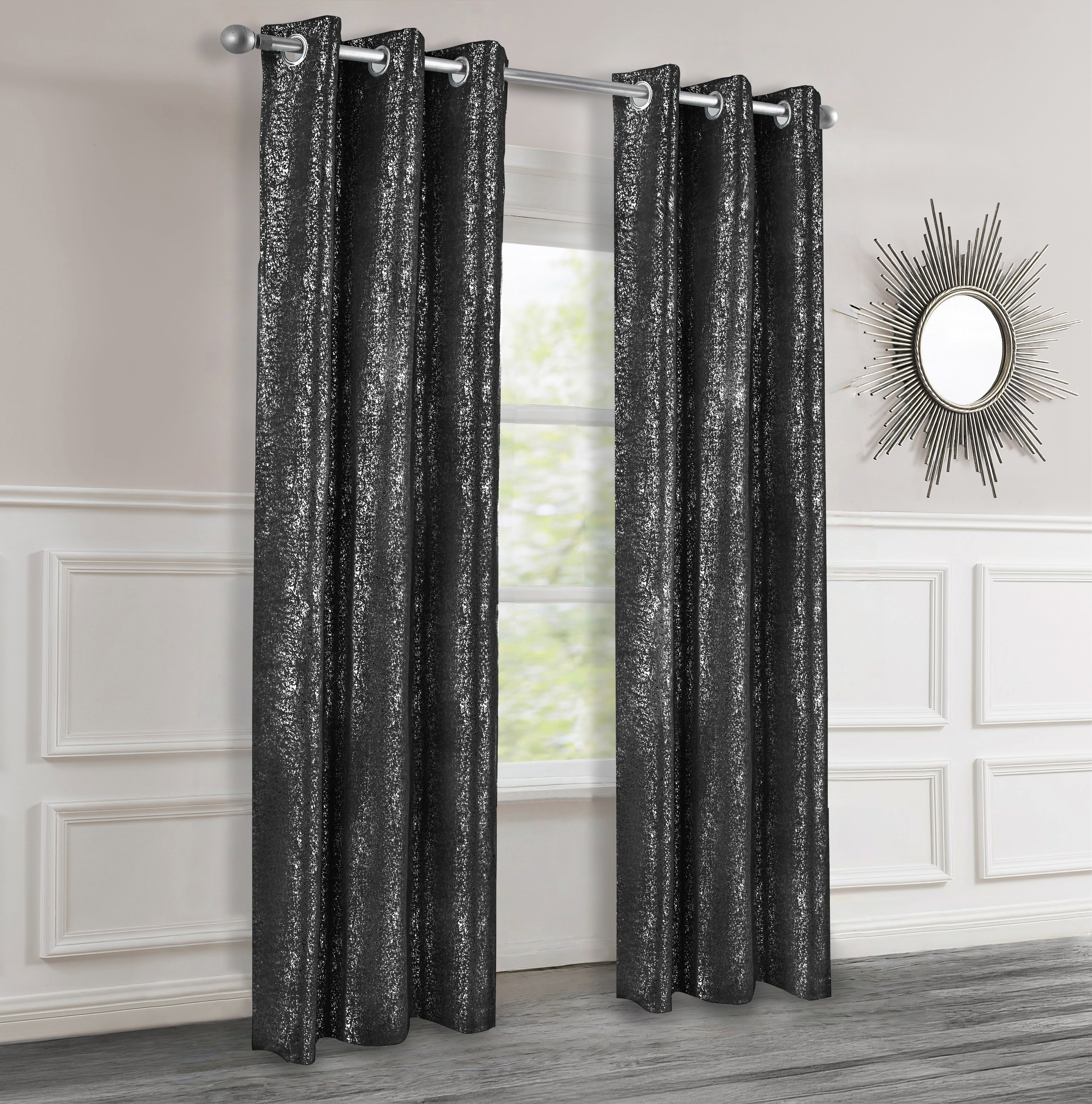 Black lurex curtains in a room with a mirror on the wall.