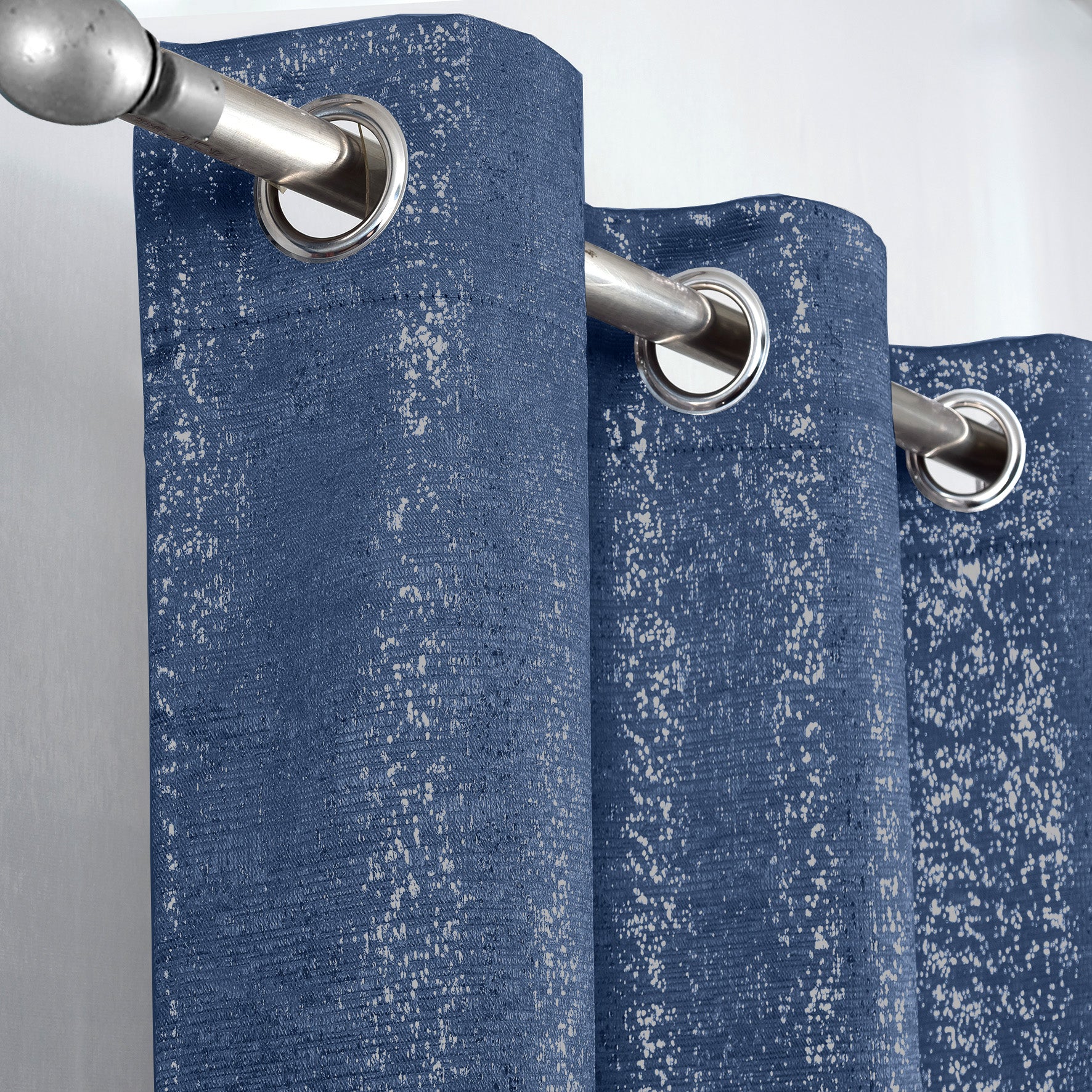 Navy Blue Glittery curtain with silver grommets on a gray background