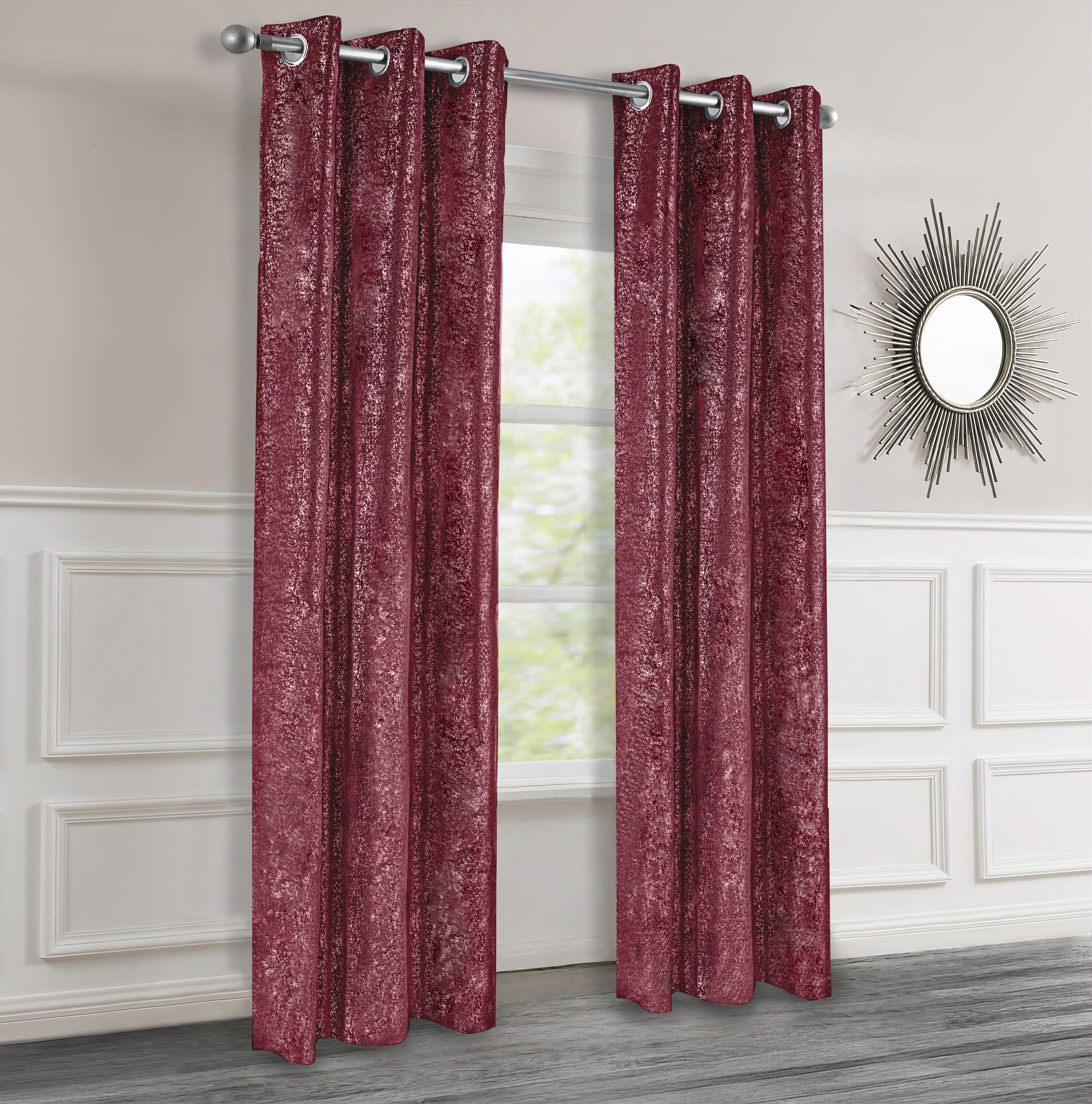 Burgundy textured curtains with silver lurex hanging in a room with a mirror on the wall.